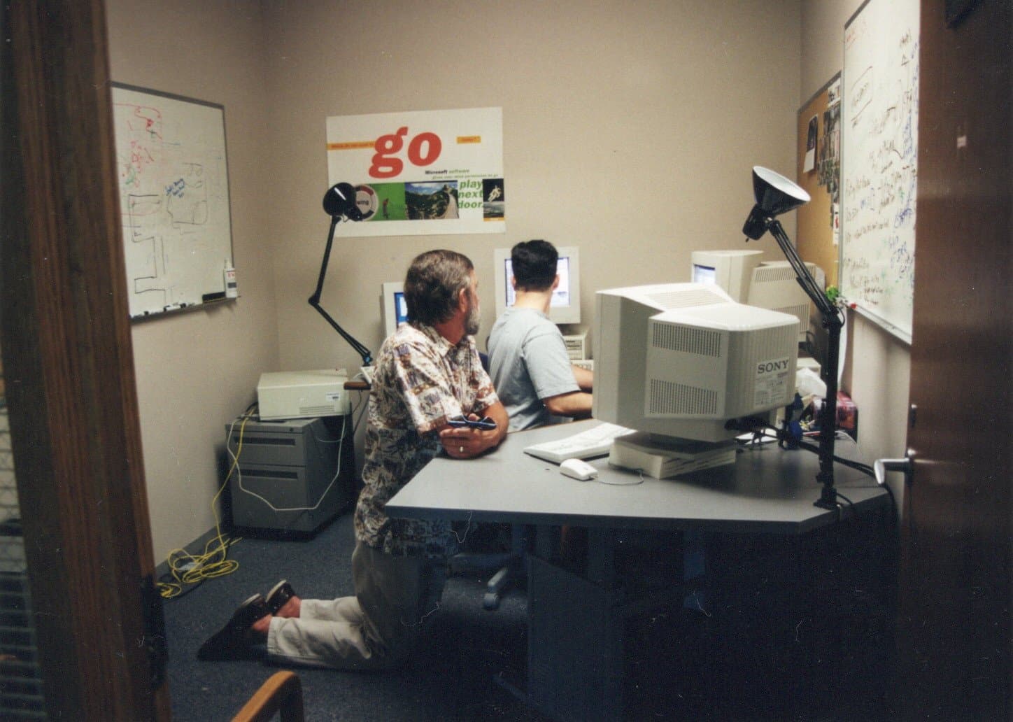 Tosh Meston showing his father around his Microsoft office